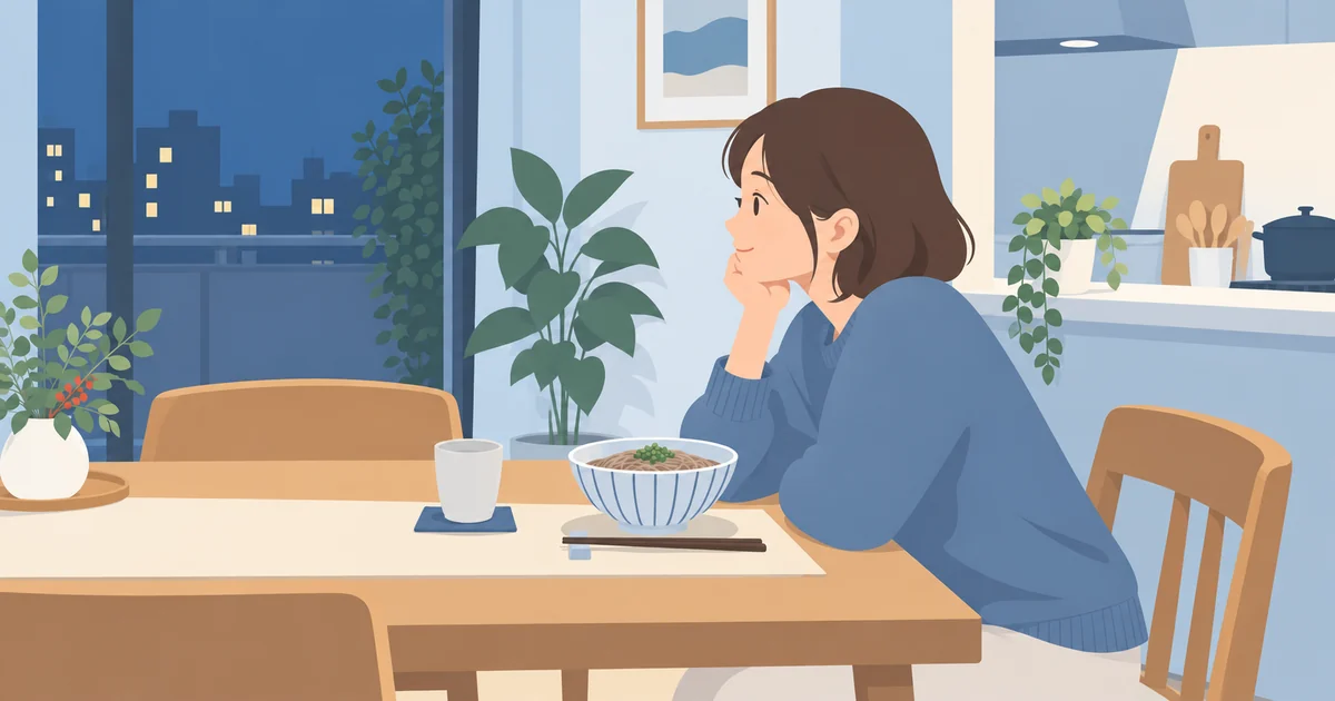 夜の食卓でそばを食べるタイミングを考える場面
