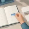 手帳の予定枠へ青い付箋を置いて日時を確保する様子
